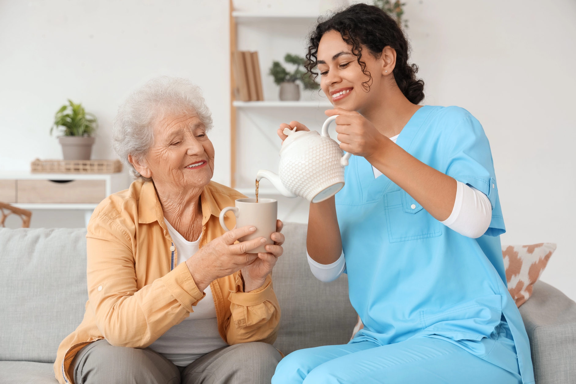 Caregiver reviewing documents with elderly patient